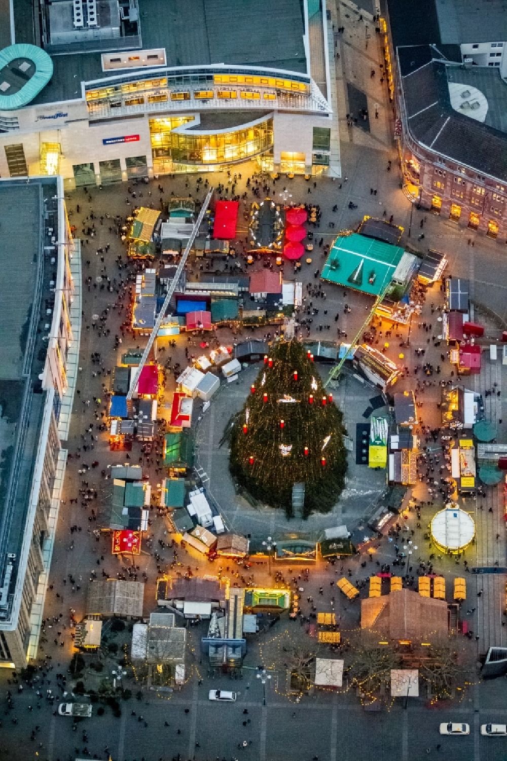 Aerial image at night Dortmund - Night aerial view from the Christmas market at the Hansa square with the big Christmas Tree in the city of Dortmund in North Rhine-Westphalia