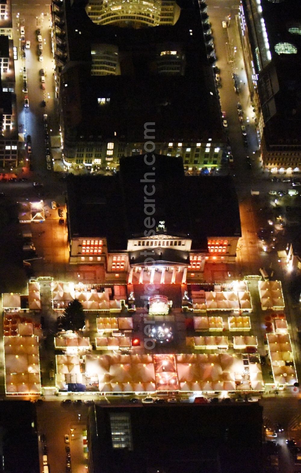 Aerial image at night Berlin - Night view christmas market on place area Gendarmenmarkt with the building ensemble German and French Cathedral, Schauspielhaus in Berlin Mitte