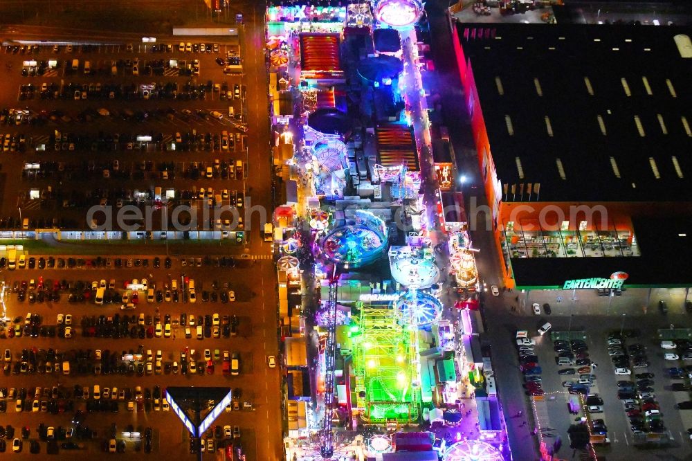 Aerial image at night Berlin - Night lighting christmas - event site on Landsberger Allee in the district Lichtenberg in Berlin, Germany
