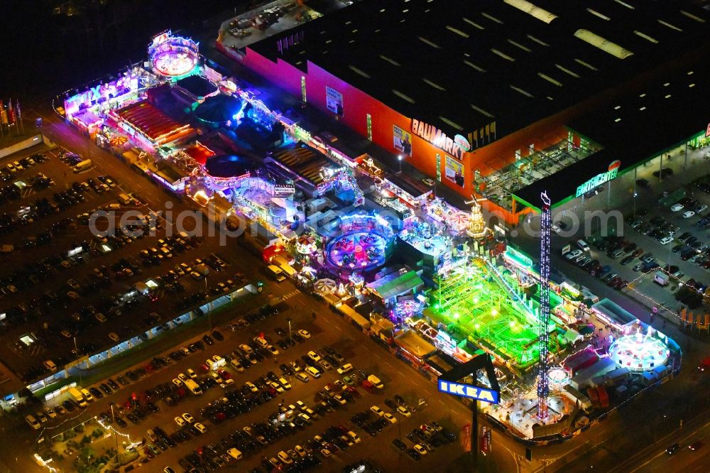 Berlin at night from the bird perspective: Night lighting christmas - event site on Landsberger Allee in the district Lichtenberg in Berlin, Germany