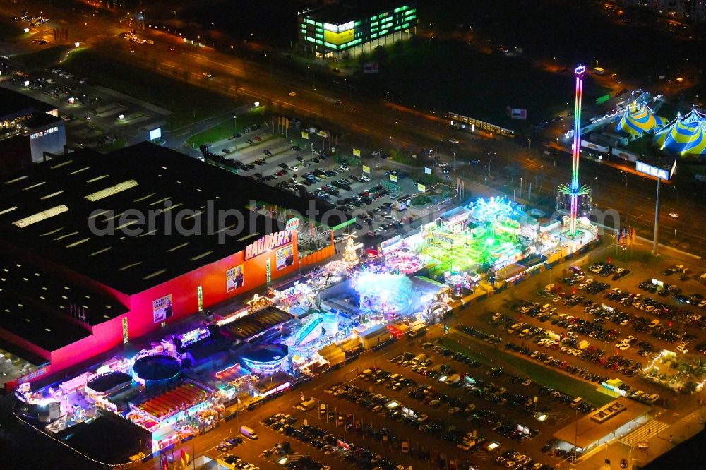 Aerial image at night Berlin - Night lighting christmas - event site on Landsberger Allee in the district Lichtenberg in Berlin, Germany
