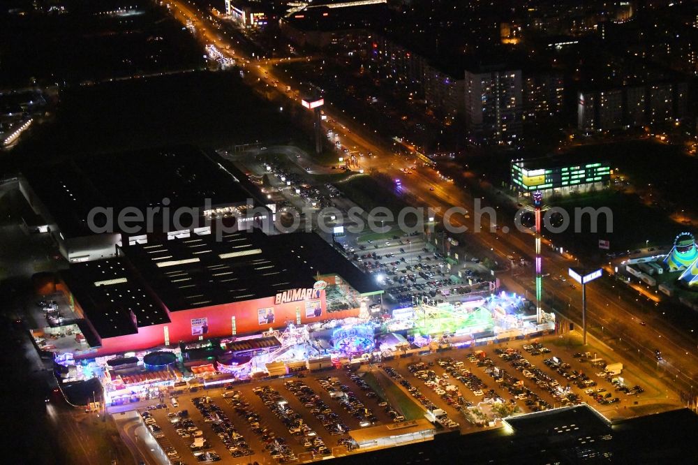 Berlin at night from the bird perspective: Night lighting christmas - event site on Landsberger Allee in the district Lichtenberg in Berlin, Germany