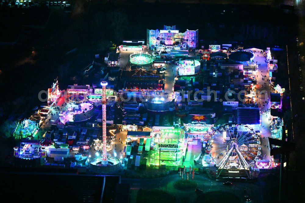 Aerial photograph at night Berlin - Night lighting christmas - event site on street Landsberger Allee in the district Lichtenberg in Berlin, Germany