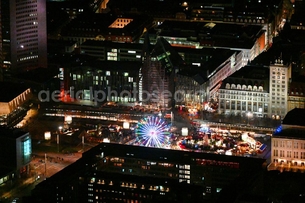 Aerial photograph at night Leipzig - Night lighting Christmassy market event grounds and sale huts and booths on Augustusplatz in Leipzig in the state Saxony, Germany