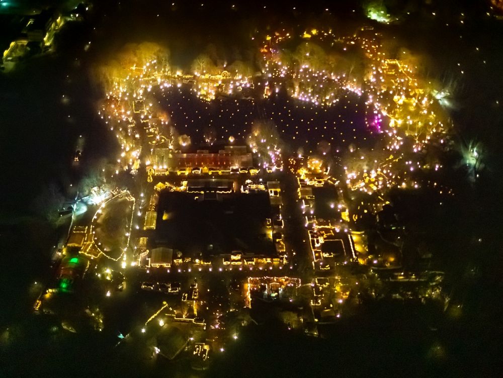 Dortmund at night from above - Night lighting christmassy market event grounds and sale huts and booths in Fredenbaumpark in Dortmund in the state North Rhine-Westphalia, Germany