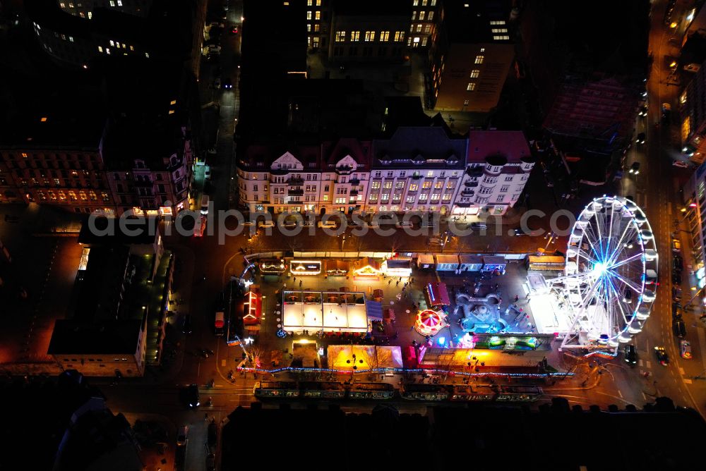 Halle (Saale) at night from above - Night lighting christmassy market event grounds and sale huts and booths on place Marktplatz in the district Altstadt in Halle (Saale) in the state Saxony-Anhalt, Germany