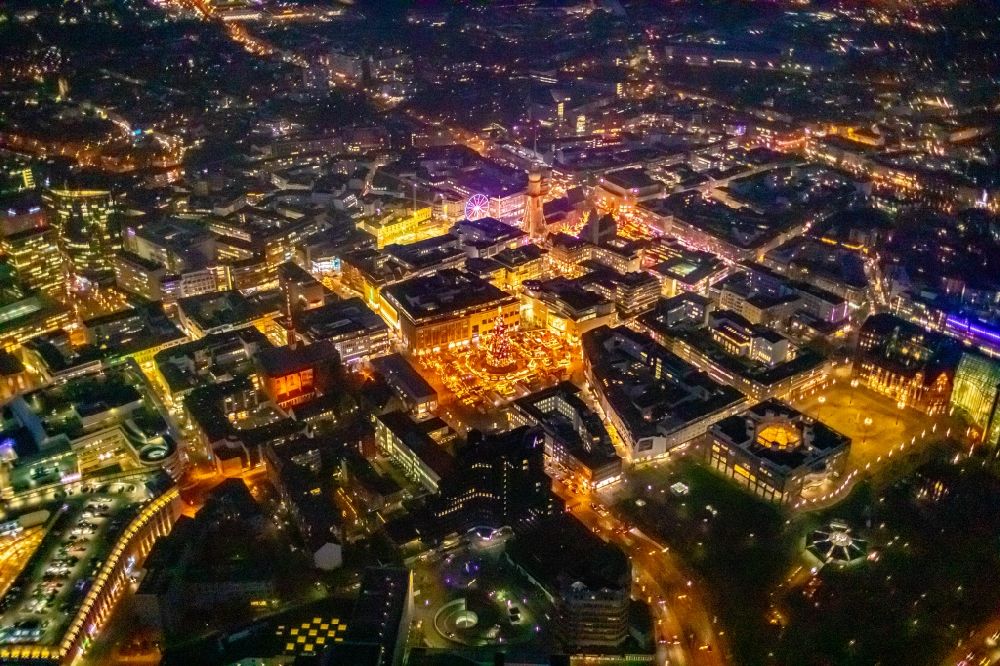 Aerial photograph at night Dortmund - Night lighting christmassy market event grounds and sale huts and booths on Hansaplatz in Dortmund in the state North Rhine-Westphalia, Germany