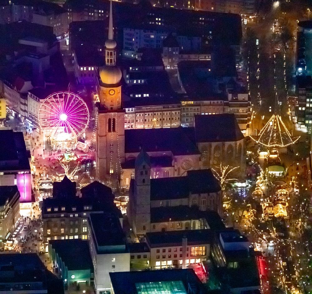 Aerial image at night Dortmund - Night lighting christmassy market event grounds and sale huts and booths on Hansaplatz in Dortmund in the state North Rhine-Westphalia, Germany