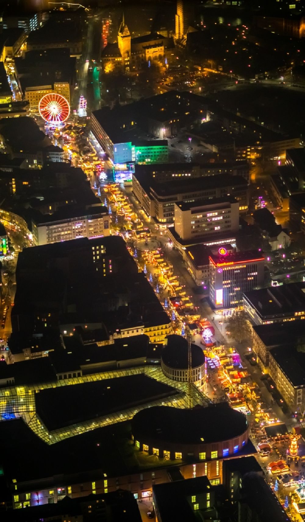 Aerial image at night Duisburg - Night lighting christmassy market event grounds and sale huts and booths auf der Koenigsstrasse in Duisburg in the state North Rhine-Westphalia. In the picture as well the shopping centre Duisburg
