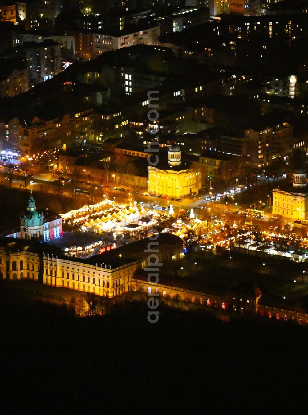 Aerial photograph at night Berlin - Night lighting Christmassy market event grounds and sale huts and booths on Schloss Charlottenburg in the district Charlottenburg in Berlin, Germany