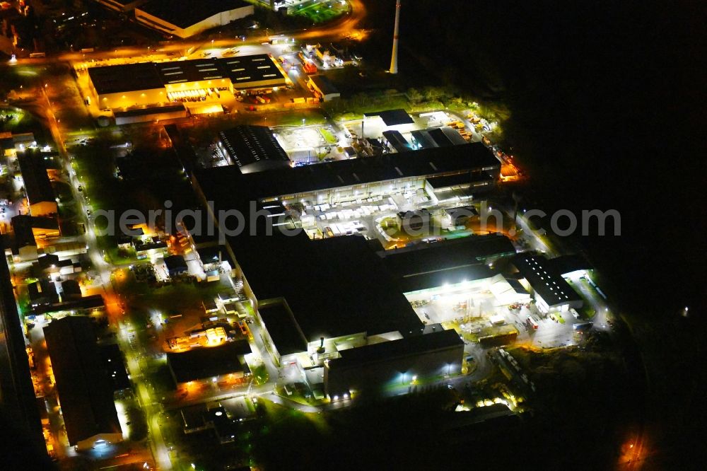 Hamburg at night from the bird perspective: Night lighting building and production halls on the premises on Aluminiumstrasse in the district Altenwerder in Hamburg, Germany