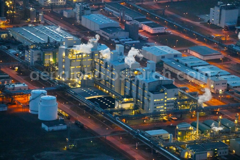 Aerial photograph at night Schwarzheide - Night lighting factory premises of BASF Schwarzheide GmbH in Brandenburg