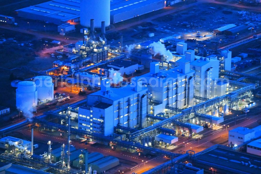 Aerial image at night Schwarzheide - Night lighting factory premises of BASF Schwarzheide GmbH in Brandenburg