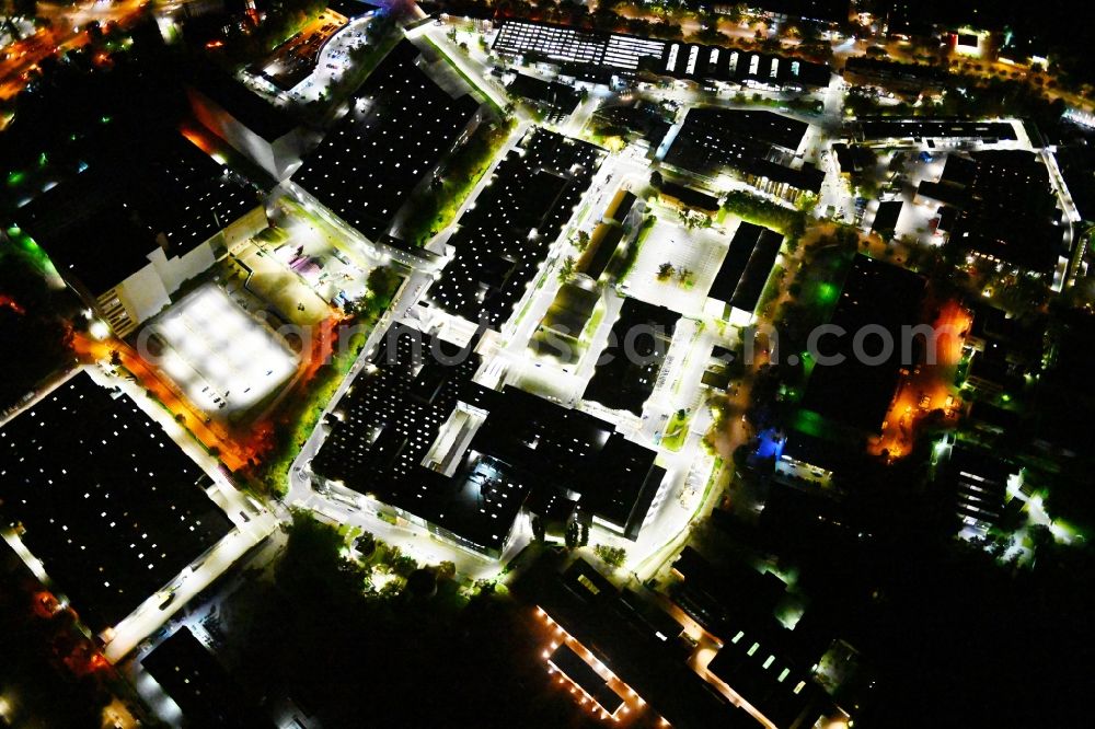 Aerial photograph at night Berlin - Night lighting factory area of a??a??the Bayerische Motoren Werke / BMW AG motorcycle plant at the Juliusturm in the district of Spandau in Berlin, Germany