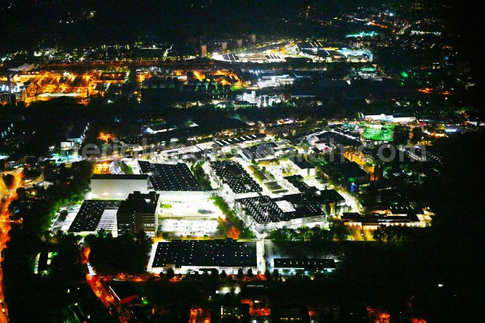 Berlin at night from the bird perspective: Night lighting factory area of the Bayerische Motoren Werke / BMW AG motorcycle plant at the Juliusturm in the district of Spandau in Berlin, Germany