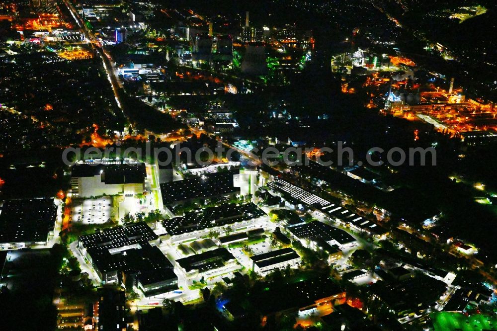 Aerial photograph at night Berlin - Night lighting factory area of the Bayerische Motoren Werke / BMW AG motorcycle plant at the Juliusturm in the district of Spandau in Berlin, Germany