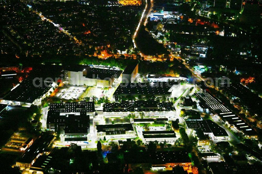 Berlin at night from above - Night lighting factory area of the Bayerische Motoren Werke / BMW AG motorcycle plant at the Juliusturm in the district of Spandau in Berlin, Germany