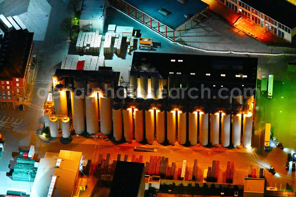 Berlin at night from above - Night lighting building and production halls on the premises of the brewery Berliner-Kindl-Schultheiss-Brauerei on Indira-Gandhi-Strasse in the district Hohenschoenhausen in Berlin, Germany