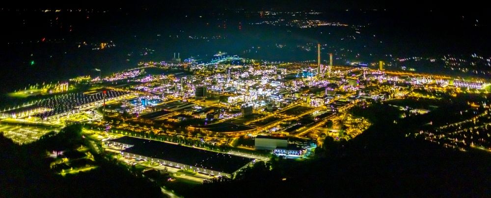 Marl at night from above - Night lighting aerial view of buildings and production halls on the site of the chemical producer Chemiepark Marl, formerly Chemische Werke Huels AG on Paul-Baumann Strasse in Marl in the German state of North Rhine-Westphalia