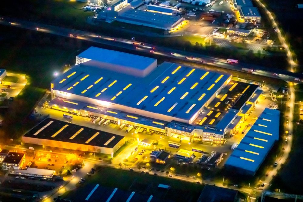 Aerial photograph at night Hamm - Night lighting building and production halls on the premises of Claas Service ond Parts GmbH on Kronstrasse in the district Uentrop in Hamm in the state North Rhine-Westphalia, Germany