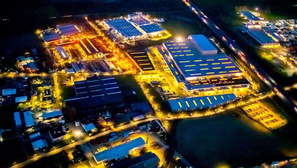 Aerial image at night Hamm - Night lighting building and production halls on the premises of Claas Service ond Parts GmbH on Kronstrasse in the district Uentrop in Hamm in the state North Rhine-Westphalia, Germany
