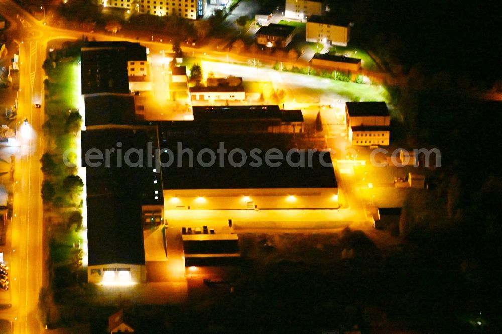 Aerial image at night Wernigerode - Night lighting building and production halls on the premises of of Pharma Wernigerode GmbH on Dornbergsweg in Wernigerode in the state Saxony-Anhalt, Germany