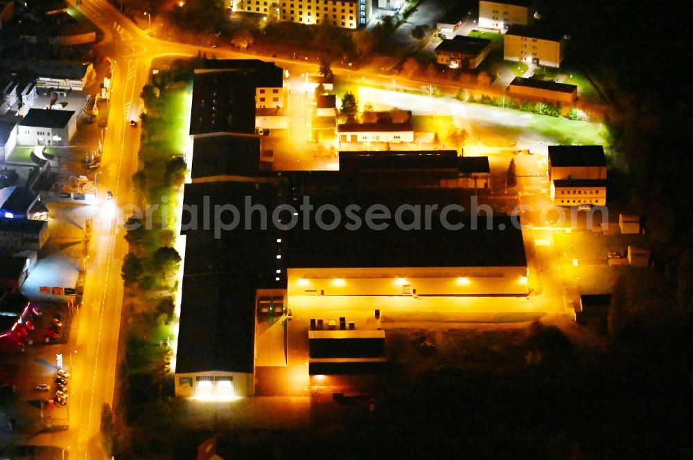 Wernigerode at night from above - Night lighting building and production halls on the premises of of Pharma Wernigerode GmbH on Dornbergsweg in Wernigerode in the state Saxony-Anhalt, Germany