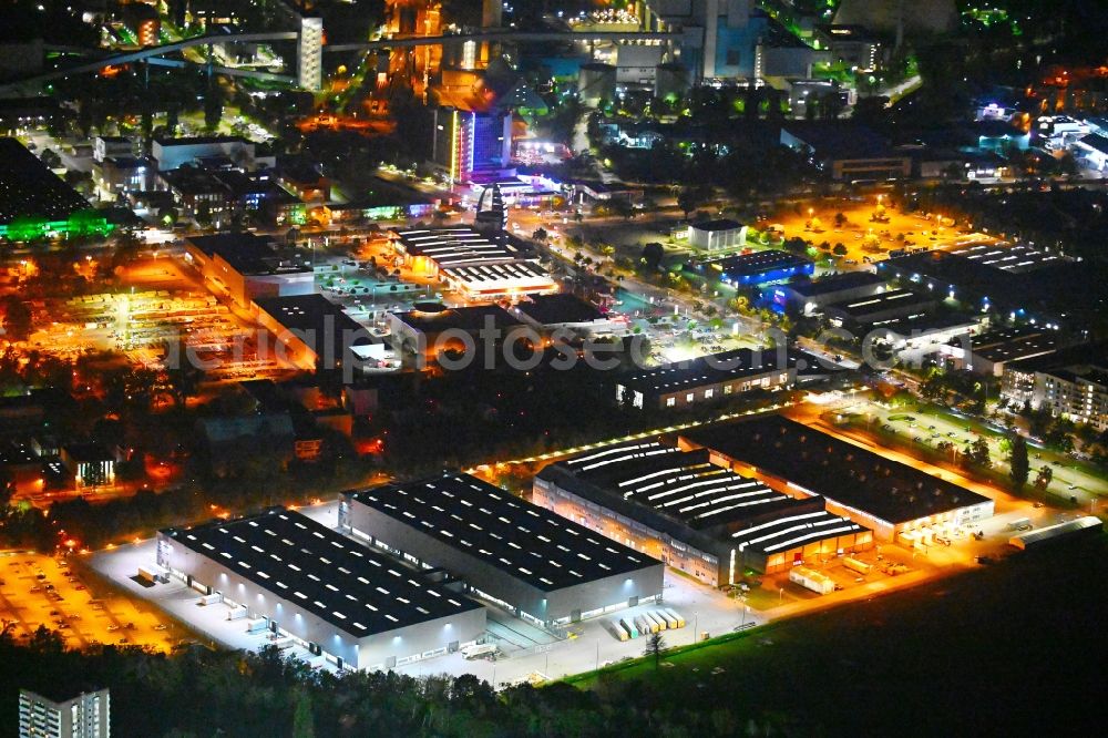 Berlin at night from above - Night lighting building and production halls on the premises of Siemens Energy Schaltwerk Hochspannung (Switchgear Factory) on street Paulsternstrasse in the district Siemensstadt in Berlin, Germany