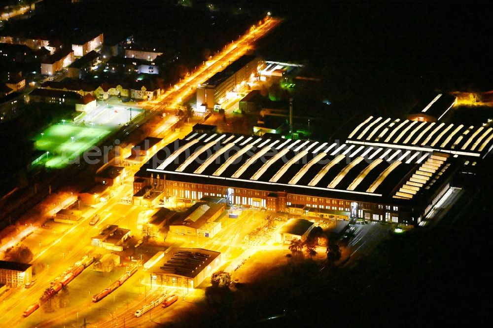 Dessau at night from above - Night lighting building and production halls on the premises of DB Fahrzeuginstandhaltung GmbH, factory Dessau on Peterholzstrasse in Dessau in the state Saxony-Anhalt, Germany