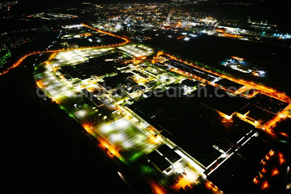 Aerial image at night Saarlouis - Night lighting building and production halls on the premises of Ford factorye on Henry-Ford-Strasse in the district Roden in Saarlouis in the state Saarland, Germany
