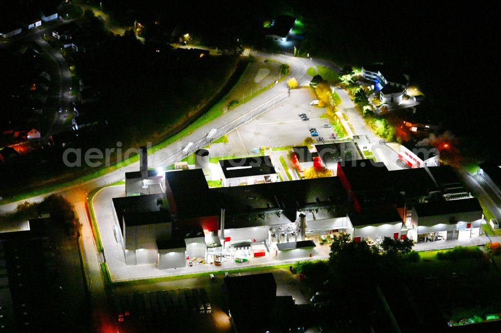Bexbach at night from above - Night lighting building and production halls on the premises Fuchs & Hoffmann Kakaoprodukte GmbH in Bexbach in the state Saarland, Germany
