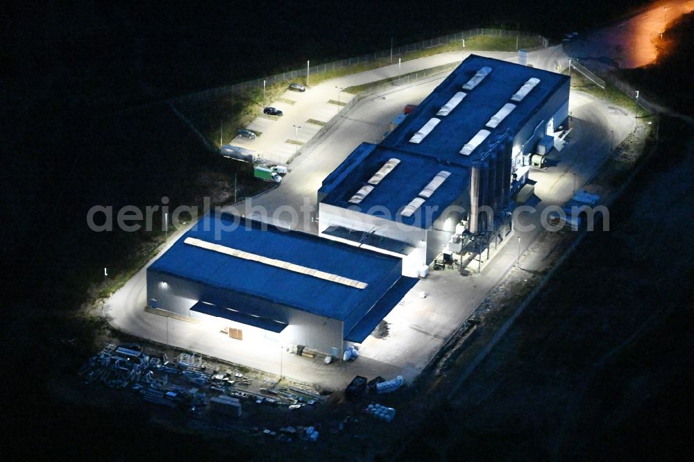 Aerial photograph at night Schwerin - Night lighting night view building and production halls on the premises of FVH Folienveredelung an der Ludwig-Boelkow-Strasse in Schwerin in the state Mecklenburg - Western Pomerania