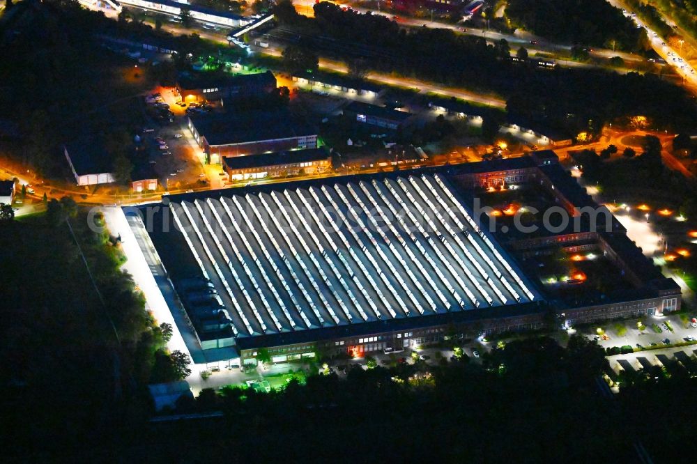 Berlin at night from above - Night lighting building and production halls on the premises of HASSE & WREDE GmbH on Georg-Knorr-Strasse in the district Marzahn in Berlin, Germany