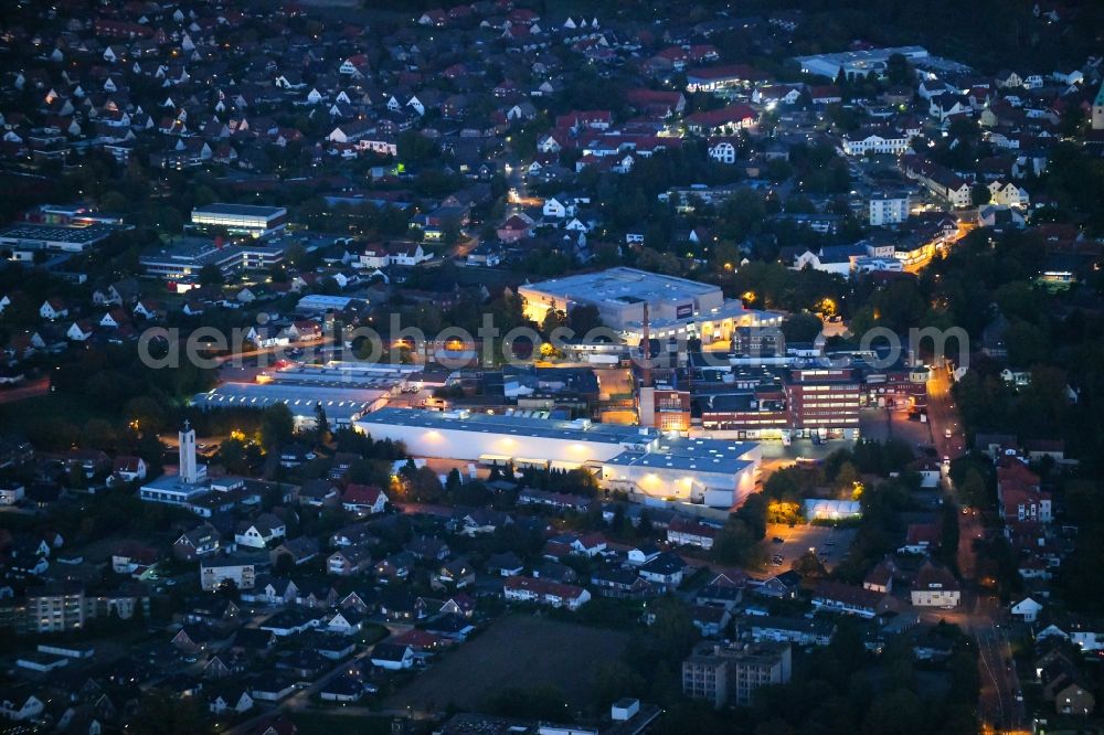 Aerial image at night Dissen am Teutoburger Wald - Night lighting Building and production halls on the premises of Homann Feinkost GmbH in Dissen am Teutoburger Wald in the state Lower Saxony, Germany