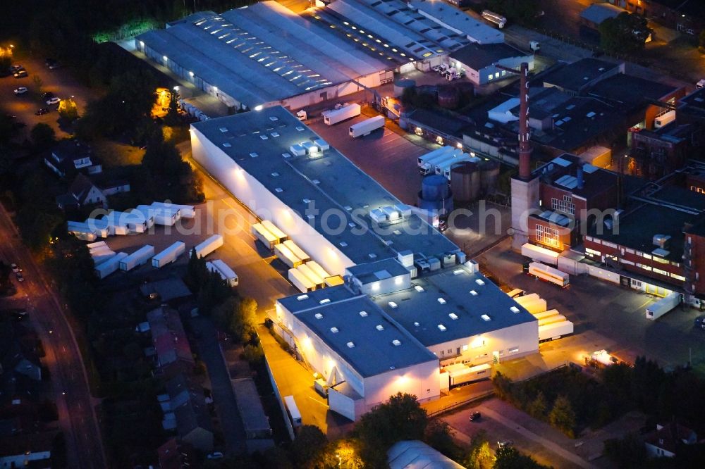 Dissen am Teutoburger Wald at night from above - Night lighting Building and production halls on the premises of Homann Feinkost GmbH in Dissen am Teutoburger Wald in the state Lower Saxony, Germany