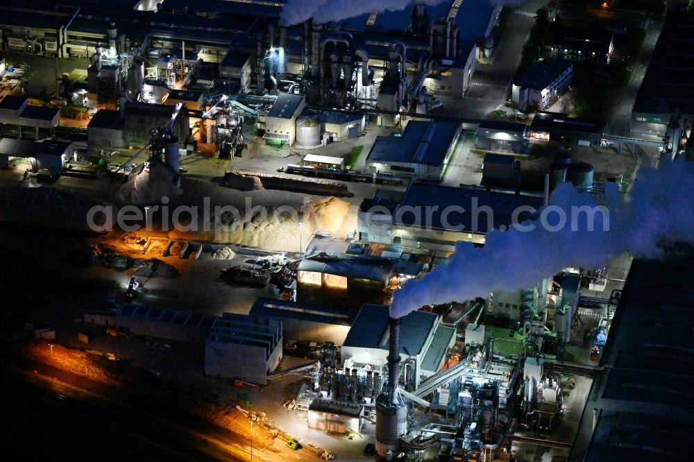 Aerial image at night Heiligengrabe - Night lighting building and production halls on the premises of KRONOTEX GmbH in Heiligengrabe in the state Brandenburg, Germany