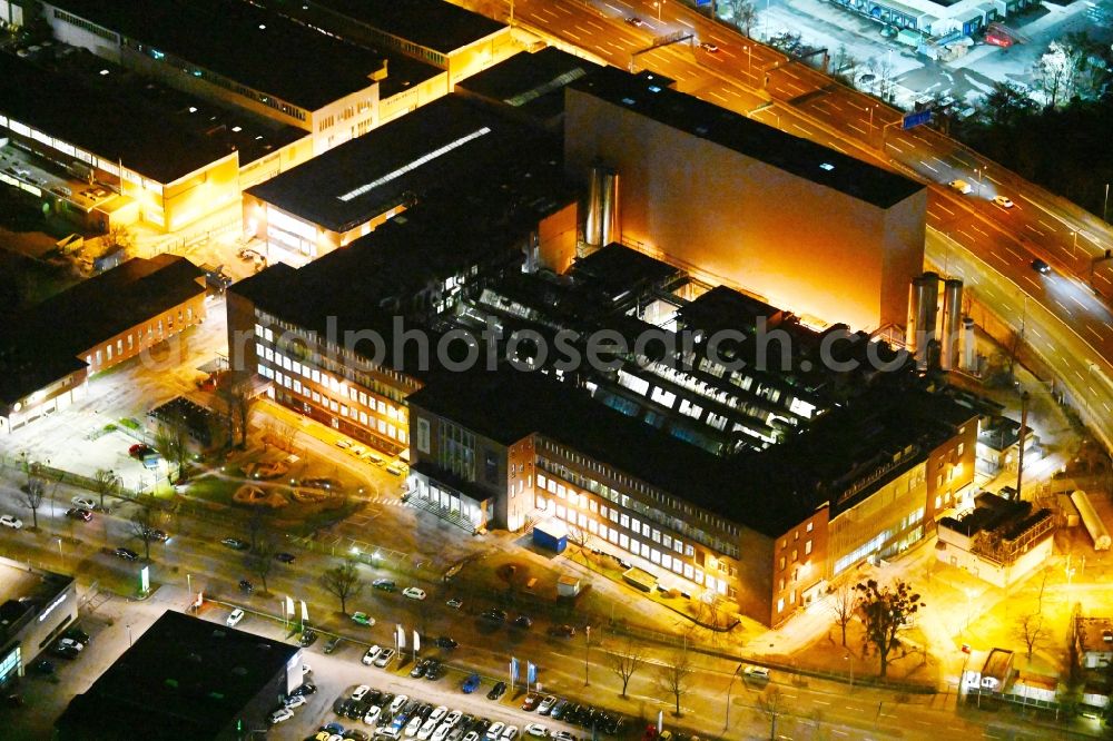 Berlin at night from above - Night lighting building and production halls on the premises of Procter & Gamble Manufacturing Berlin GmbH on Oberlandstrasse in the district Tempelhof-Schoeneberg in Berlin, Germany