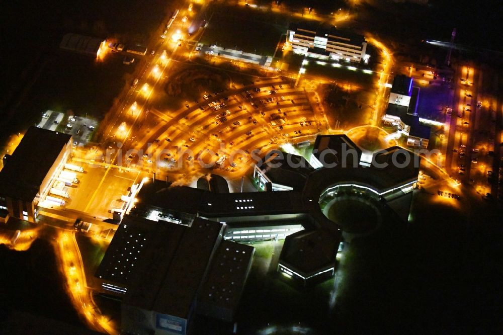 Barleben at night from above - Night lighting building and production halls on the premises of Salutas Pharma GmbH on Otto-von-Guericke-Allee in the district Suelzegrund in Barleben in the state Saxony-Anhalt, Germany