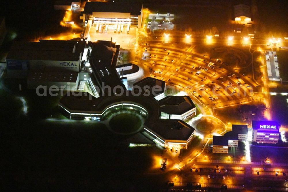Barleben at night from the bird perspective: Night lighting building and production halls on the premises of Salutas Pharma GmbH on Otto-von-Guericke-Allee in the district Suelzegrund in Barleben in the state Saxony-Anhalt, Germany