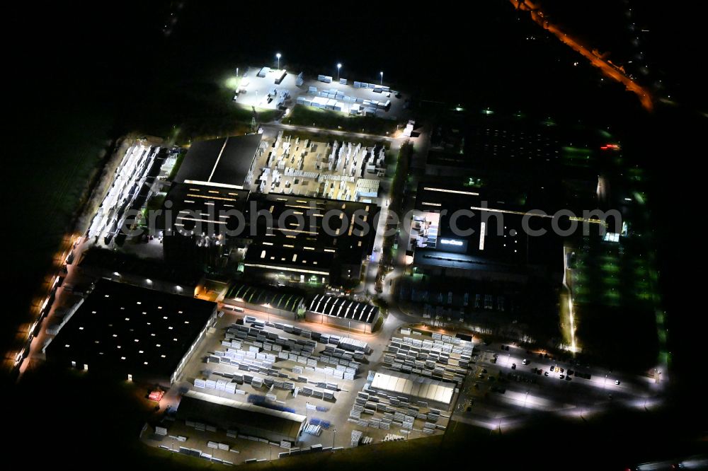 Weißenfels at night from the bird perspective: Night lighting building and production halls on the premises of Schueco Polymer Technologies KG on street Selauer Strasse in the district Borau in Weissenfels in the state Saxony-Anhalt, Germany
