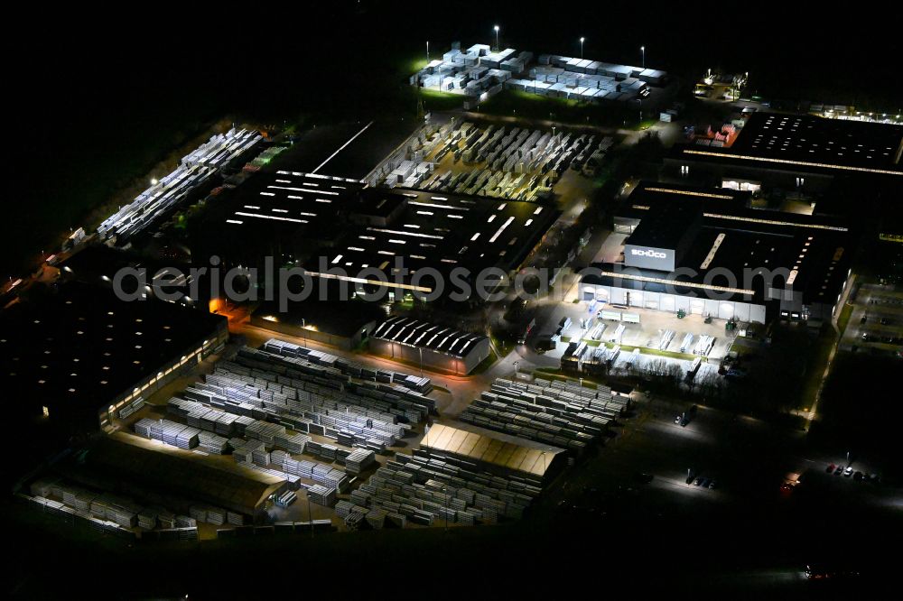 Aerial photograph at night Weißenfels - Night lighting building and production halls on the premises of Schueco Polymer Technologies KG on street Selauer Strasse in the district Borau in Weissenfels in the state Saxony-Anhalt, Germany
