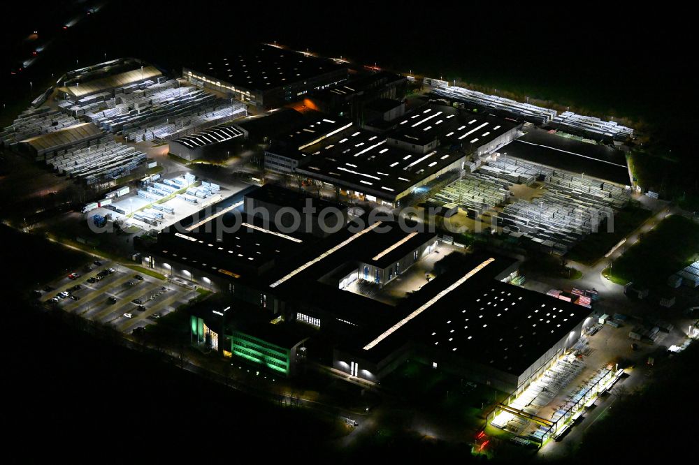 Aerial image at night Weißenfels - Night lighting building and production halls on the premises of Schueco Polymer Technologies KG on street Selauer Strasse in the district Borau in Weissenfels in the state Saxony-Anhalt, Germany
