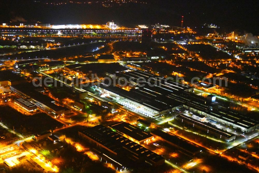 Aerial image at night Eisenhüttenstadt - Night lighting Building and production halls on the premises of steelworks Arcelor Mittal in Eisenhuettenstadt in the state Brandenburg