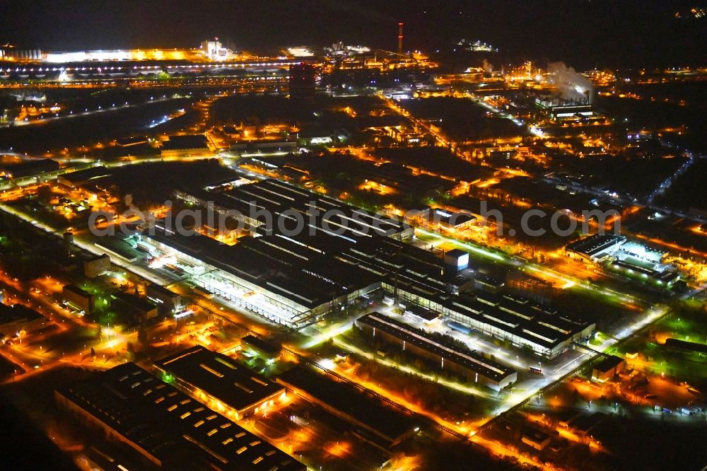 Eisenhüttenstadt at night from above - Night lighting Building and production halls on the premises of steelworks Arcelor Mittal in Eisenhuettenstadt in the state Brandenburg