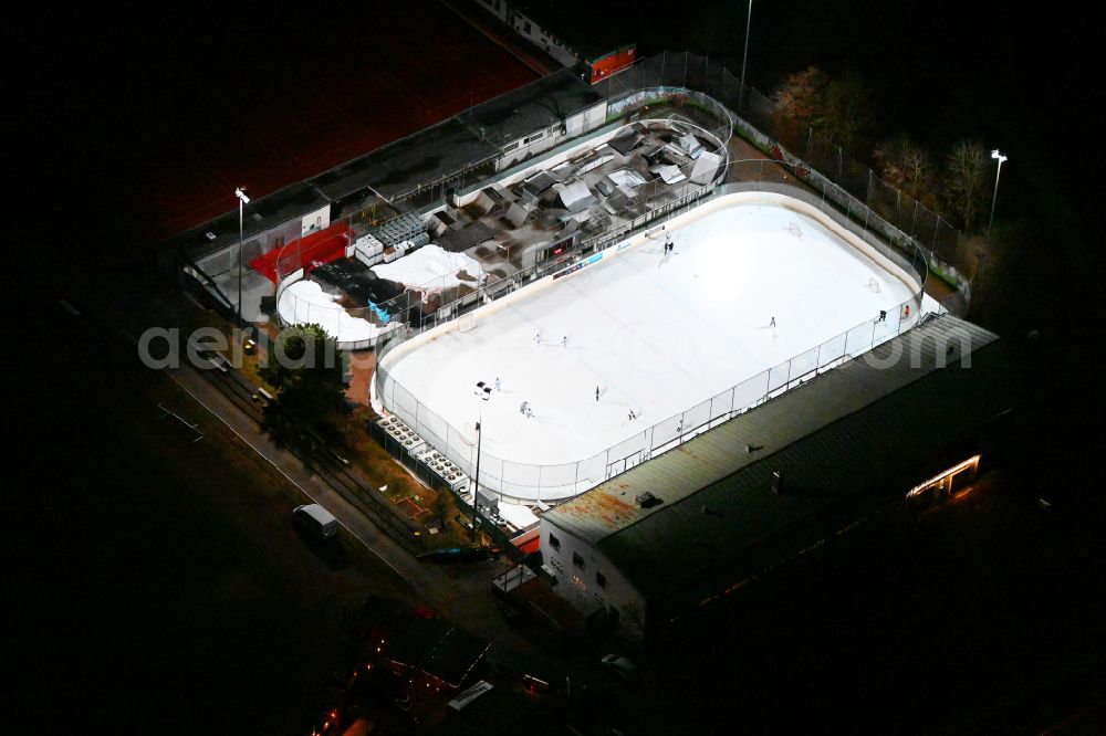 Aerial photograph at night München - Night lighting wintry white shining ice covering Eis- and Funsportzentrum West on street Agnes-Bernauer-Strasse in Munich in the state Bavaria, Germany
