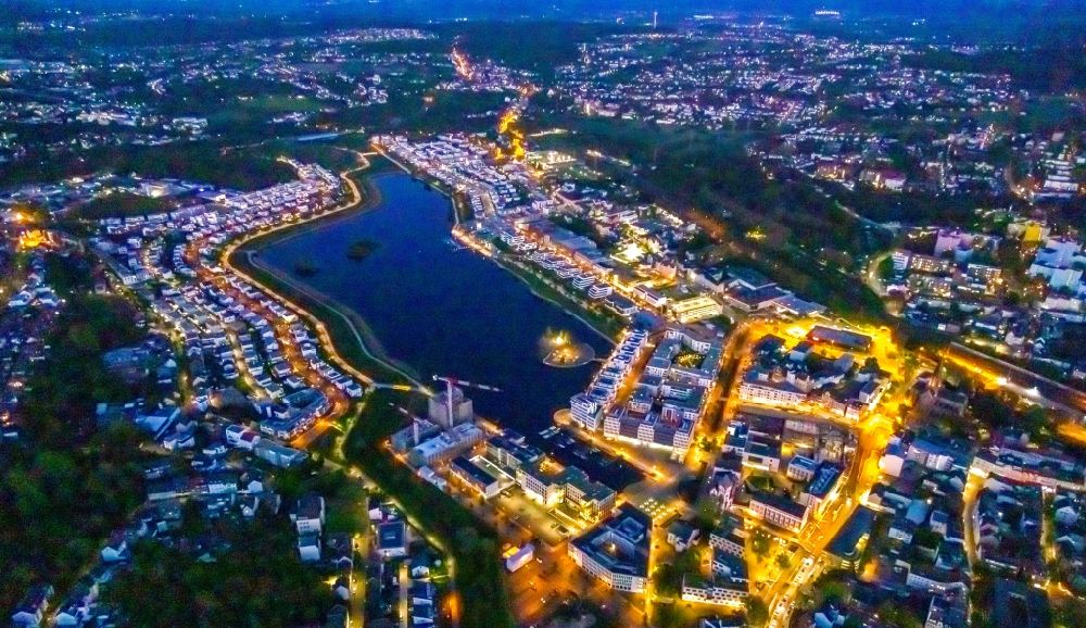 Aerial photograph at night Dortmund - Night lighting residential area of the multi-family house Settlement at shore Areas of lake Phoenix See in the district Hoerde in Dortmund at Ruhrgebiet in the state North Rhine-Westphalia, Germany
