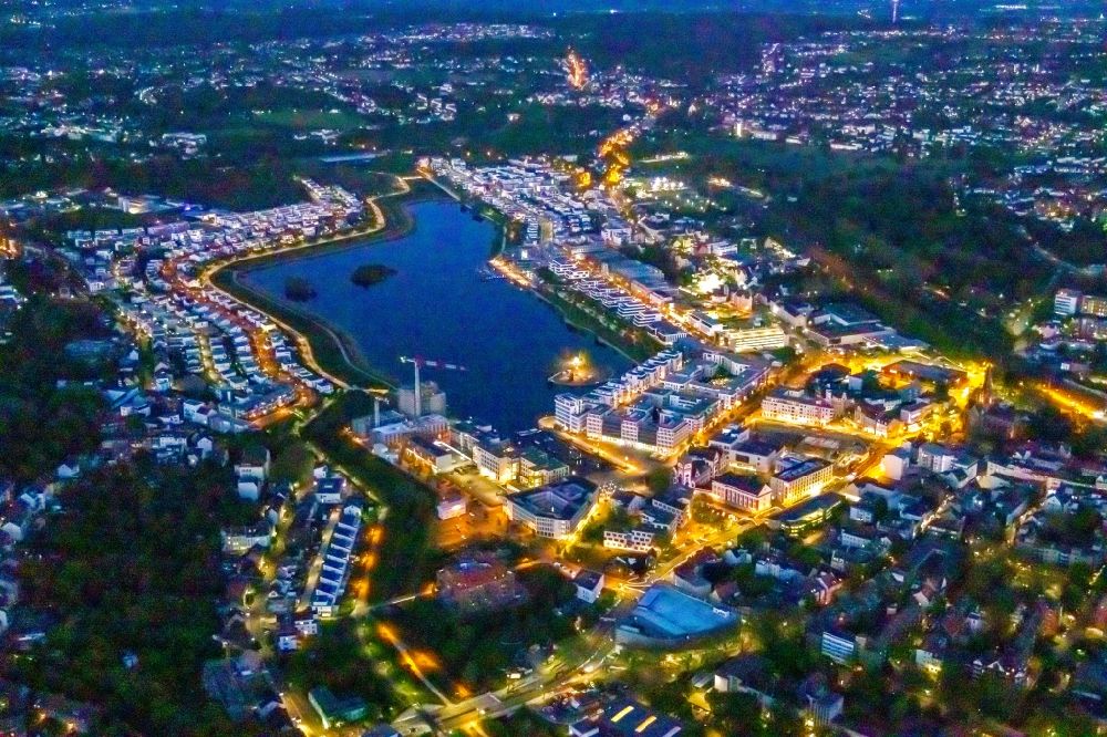 Aerial image at night Dortmund - Night lighting development area on lake Phoenix See in Dortmund in the state North Rhine-Westphalia
