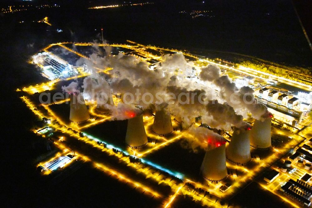 Teichland at night from above - Night lighting clouds of exhaust gas in the cooling towers of the power plant Jaenschwalde, a lignite-fired thermal power plant in southeastern Brandenburg. Power plant operator is to Vattenfall Europe belonging Vattenfall Europe Generation AG, which emerged from VEAG
