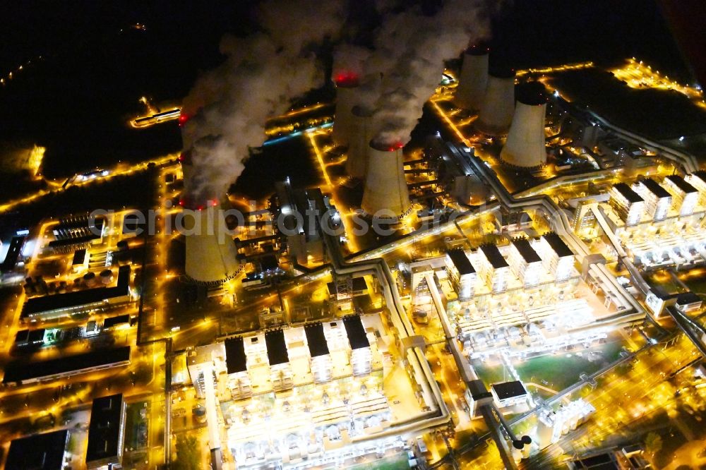 Aerial image at night Teichland - Night lighting clouds of exhaust gas in the cooling towers of the power plant Jaenschwalde, a lignite-fired thermal power plant in southeastern Brandenburg. Power plant operator is to Vattenfall Europe belonging Vattenfall Europe Generation AG, which emerged from VEAG