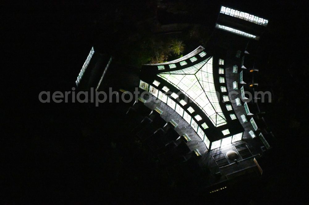 Berlin at night from the bird perspective: Night lighting zoo grounds at the Alfred Brehm House in Tierpark in the district of Friedrichsfelde in Berlin, Germany